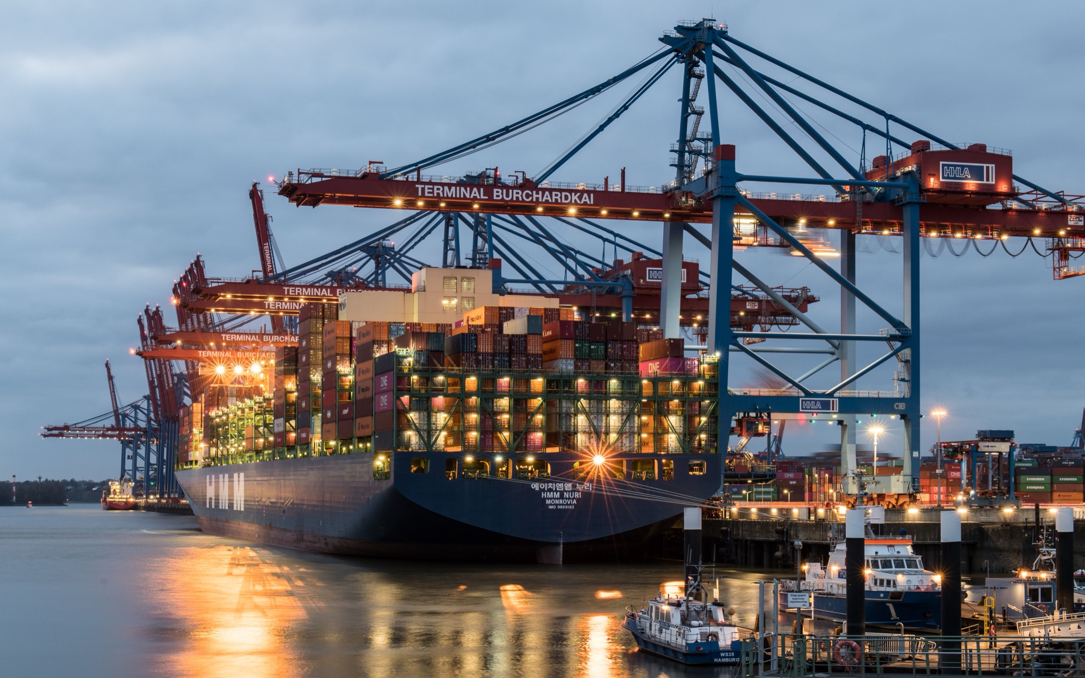 Container vessel at terminal during evening operations