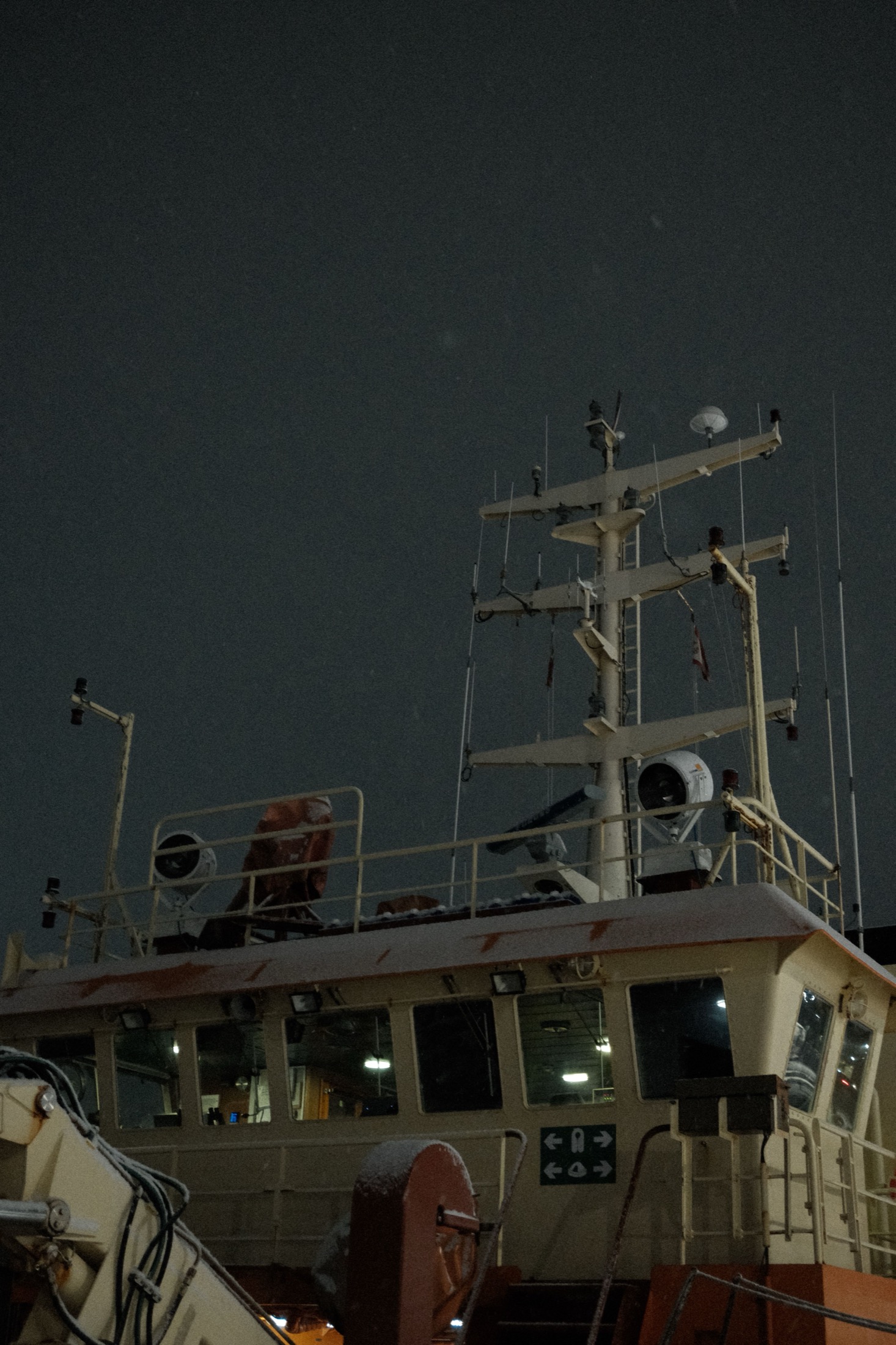 Vessel bridge and mast at night